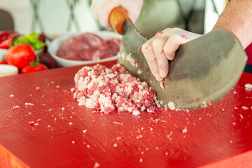 Preparing adana kebab with chopping knife ,turkish traditional food Adana kebab
