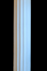 Poster - white stone column isolated on black