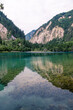 Vertical image of the beautiful Five-Color Pond lake in Jiuzhaigou Valley Scenic Area, Aba Tibetan Autonomous region, Sichuan, China, copy space for text