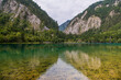 Horizontal image with copy space for text of turquoise aters of Five-Color Pond lake in Jiuzhaigou Scenic area, Aba Tibetan Autonomous region, Sichuan, China, background