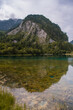 Vertical panoramic view of the two mountains reflecting from the mirror surface of the emerald turquoise Five Color Pond lake in Jiuzhaigou, Aba Tibetan Autonomous Prefecture, Sichuan, China