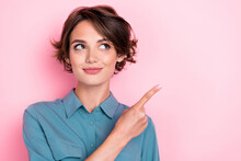 Closeup Photo Of Young Gorgeous Pretty Nice Woman Wear Blue Shirt Finger Pointing Empty Space Look Interested Shopping Sale Deal Isolated On Pink Color Background