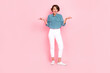 Photo of unsatisfied disappointed woman wear stylish clothes shrug shoulders wtf problem fail isolated on pink color background