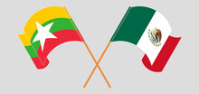 Crossed And Waving Flags Of Myanmar And Mexico
