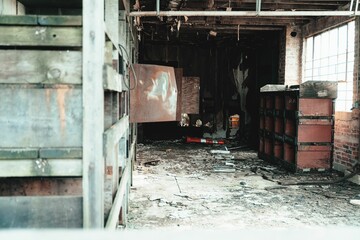 Sticker - Old warehouse abandoned building interior with grunge shelves and rusty metal boxes