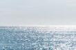 © Tetra Images - Calm sea surface reflecting sunlight