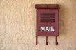 © Tetra Images - Old mailbox on wall