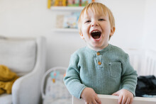 Smiling Toddler Boy (2-3) In Crib