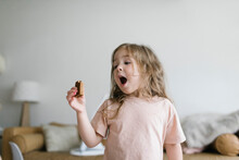 Girl (2-3) Eating Snack