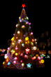 © Tetra Images - Outdoor christmas tree illuminated at night