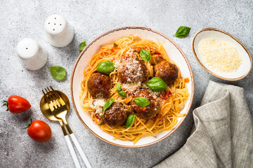 Sticker - Pasta with Meatballs in tomato sauce, basil and parmesan on stone table. Top view with copy space.