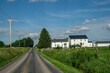 Amish houses beside a county road in Holmes County, Ohio on a summer day