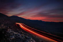 High Angle View Of Light Trails On Road Against Sky During Sunset