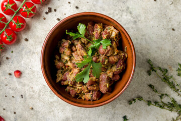 Wall Mural - bean lobio in a pot top view on stone table