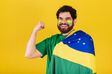 Caucasian Man With Beard, Brazilian, Soccer Fan From Brazil, Arm Raised, Concept Of Strength, Yes We Can.