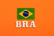 Acronym in wooden letters of the name of the country Brazil with its respective flag