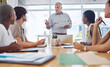© Azee J/peopleimages.com - Boss man, document and leader at presentation for business strategy discussion with office staff. Boardroom meeting with male ceo for corporate brainstorming with diverse opinion workplace team.