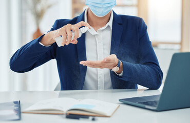 Poster - Businessman spray cleaning with a covid mask while working in an office. Entrepreneur cleaning and disinfecting his hands to prevent the spread of germs, corona and infection in the covid pandemic