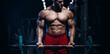 © Fotokvadrat - Muscular man bodybuilder training in gym and posing. Fit muscle guy workout with weights and barbell