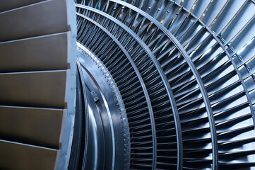 shiny rotor of powerful steam turbine in light workshop