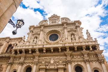 Wall Mural - The richly decorated façade of the basilica of Santa Croce with statues, columns and rose window, Lecce city center, Salento, Puglia region, Southern Italy