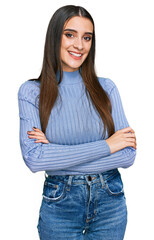 Canvas Print - Young beautiful woman wearing casual winter sweater happy face smiling with crossed arms looking at the camera. positive person.