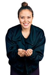 Wall Mural - Young hispanic girl wearing sportswear smiling with hands palms together receiving or giving gesture. hold and protection