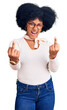 © Krakenimages.com - Young african american girl wearing casual clothes and glasses showing middle finger doing fuck you bad expression, provocation and rude attitude. screaming excited