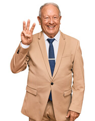 Sticker - Senior caucasian man wearing business suit and tie showing and pointing up with fingers number three while smiling confident and happy.