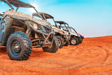 Powerful Modern ATVs Among The Arabian Dunes. Quad Bike, Rub Al Khali Desert In Dubai