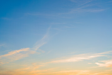 Evening cloudy sky with the setting sun