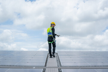 Poster - Engineer man or worker checking the operation of the system solar panels or solar cells on roof,Renewable energy source,Eco technology for electric power.