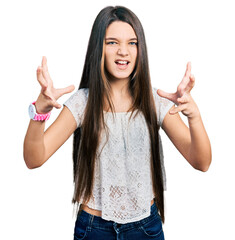 Sticker - Young brunette girl with long hair wearing white shirt shouting frustrated with rage, hands trying to strangle, yelling mad