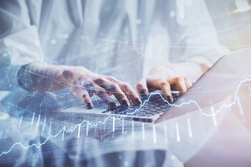 Fototapete - Double exposure of woman hands typing on computer and forex chart hologram drawing. Stock market invest concept.