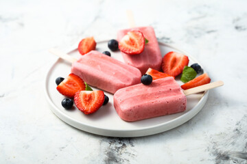 Wall Mural - Traditional homemade berry popsicles on a plate