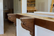 In a new kitchen, corbels were installed on the island to provide support for granite countertops on the island.