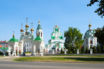 Wall Mural - view of Church of the Holy Trinity with chapel from Voznesenskaya street in Yoshkar-Ola on sunny summer day. Holy Trinity Church is the oldest temple in Tsarevokokshaysk, it was built in 1736