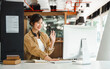 © makibestphoto - Young freelancer asian woman waving hello talking on video call, using laptop.