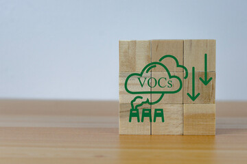 icon on wooden cubes with VOCs emission reduction icon for  VOCs emission ,green industries business. Net zero emissions. renewable energy, sustainable technology, ecology solutions concept,