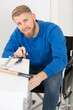 © auremar - disabled man doing diy at home
