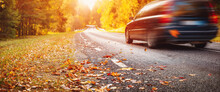Car On The Autumnal Asphalt Road In Countryside