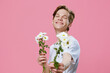 © Tatiana - cute guy stretches a bouquet of white daisies into the camera
