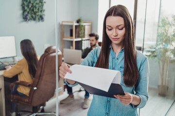 Wall Mural - Portrait of group employees coworking executive director read clipboard paperwork startup development indoors