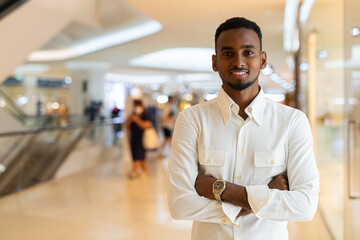 Sticker - Portrait of young handsome stylish black man in city