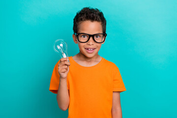 Sticker - Photo of impressed pretty small man wear yellow t-shirt eyeglasses rising light bulb isolated turquoise color background