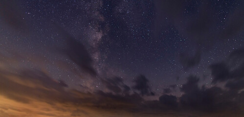 Wall Mural - Night starry sky with clouds. Night sky background.