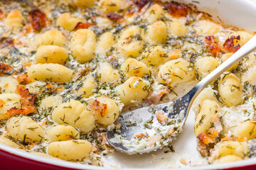 Wall Mural - baked gnocchi with salmon and dill sauce