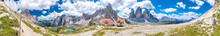 Dreizinnenhütte With Small Chapel In Front Of The Tre Cime (Drei Zinnen) And Monte Paterno (Paternkofel) Panorama In The Dolomite Alps Of South Tyrol In Italy
