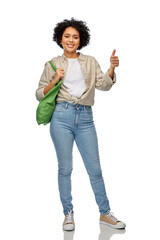 Wall Mural - eco living, zero waste and sustainability concept - portrait of happy smiling woman with green reusable canvas bag for food shopping showing thumbs up over white background