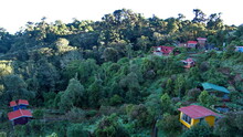 Colorful Cabins In A Garden On The Side Of The Mountain At The High Altitude Paraiso Quetzal Lodge Outside Of San Jose, Costa Rica